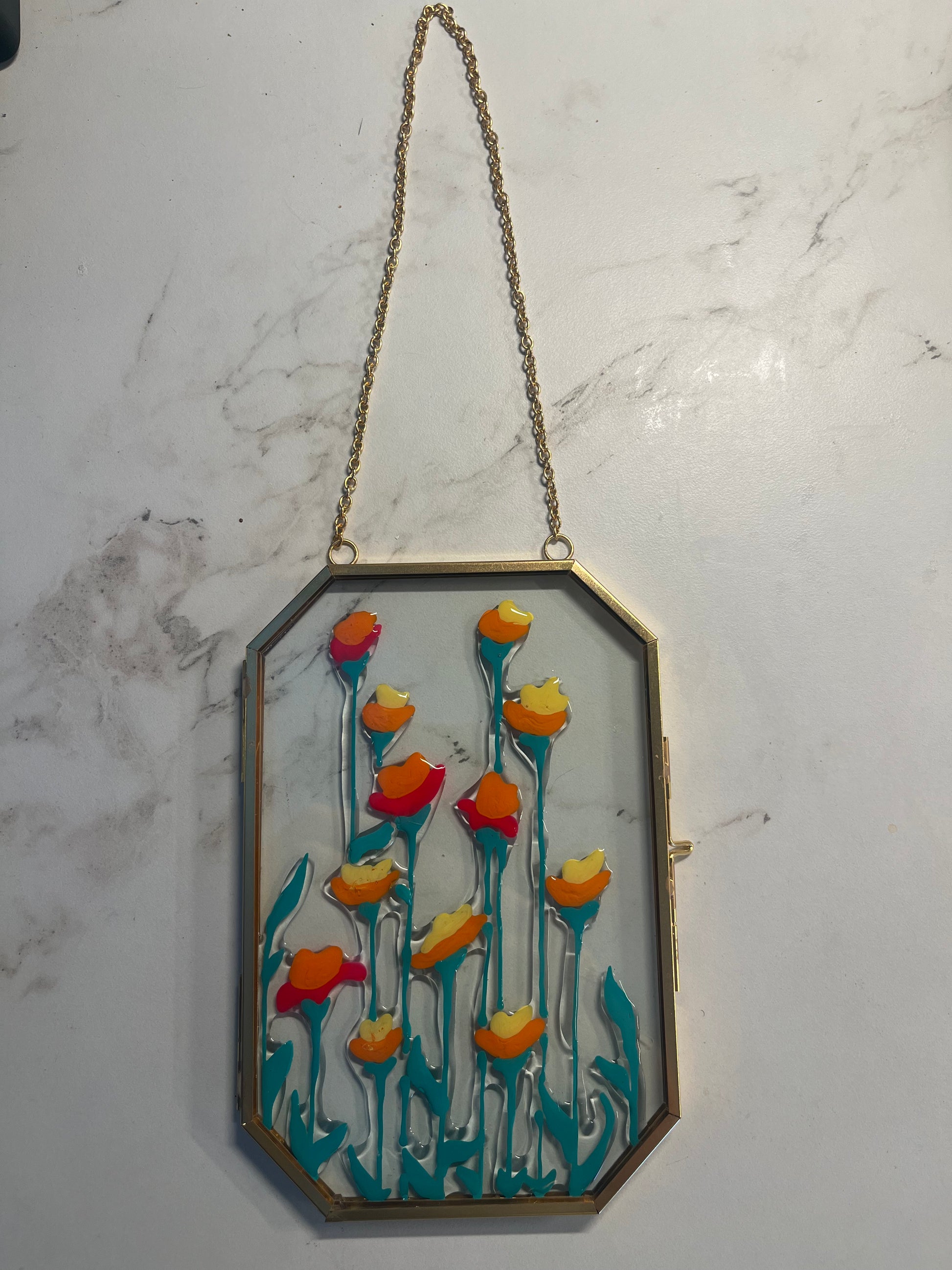 Decorative wall art with floral design on glass surface